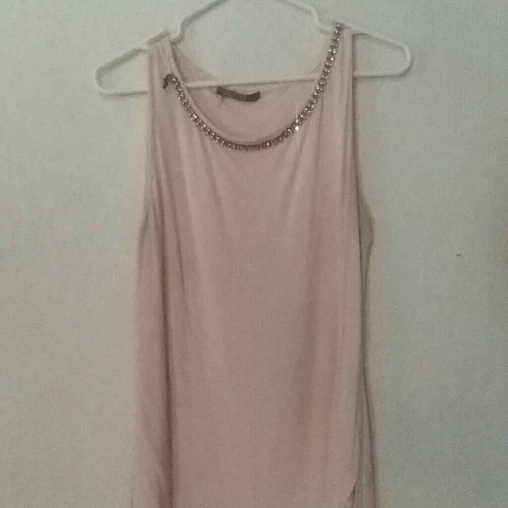 Pink and white sleeveless blouse